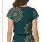 A repeating pattern of intricate gold mandala designs set against a deep teal background Crop Top