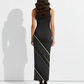 A sleek black sleeveless bodycon maxi dress highlighted with elegant diagonal gold accents for a bold, modern look.