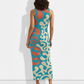 A sleeveless bodycon midi dress featuring a bold abstract swirl print in teal, coral, and beige for a modern, eye-catching look.
