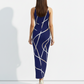 A sleeveless navy blue bodycon maxi dress featuring intersecting gold geometric lines for a chic, modern, and sophisticated look.