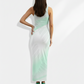 A sleeveless white bodycon maxi dress featuring soft mint-green abstract leaf washes for a serene, airy, and modern look.