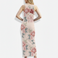 A sleeveless blush-toned bodycon maxi dress adorned with large soft pink rose prints for a romantic, feminine, and elegant look.