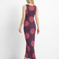 An elegant sleeveless bodycon maxi dress featuring a deep plum base adorned with vibrant mandala floral prints, blending bohemian charm with modern sophistication.