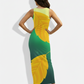 A fitted sleeveless maxi dress in rich green, highlighted with oversized golden leaf motifs for a bold, nature-inspired statement.