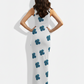 A sleek white sleeveless bodycon maxi dress featuring scattered teal-blue floral motifs for a clean, modern, and elegant look.