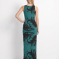 A modern sleeveless bodycon maxi dress featuring a vibrant teal base with bold black abstract brushstroke prints, creating a striking contemporary and artistic look.