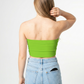 A minimalist strapless tube top in a bold neon green with a smooth, clean, and eye-catching finish.