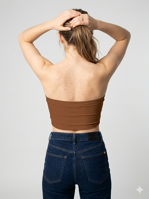 A minimalist strapless tube top in a rich solid chocolate brown with a smooth, clean finish.
