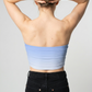 A minimalist strapless tube top in a soft pastel blue with a smooth, clean, and understated design.