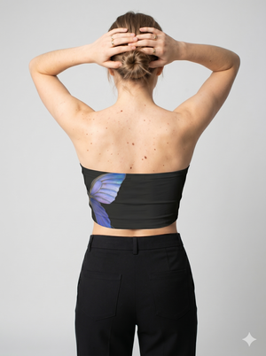 A black strapless tube top featuring a striking oversized blue butterfly wing graphic for a bold, artistic look.
