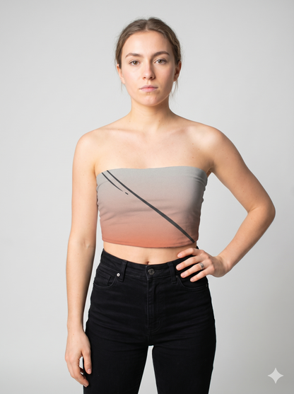 A strapless tube top featuring a soft gray-to-blush gradient with bold diagonal black lines for a modern, edgy look.