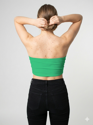 A minimalist strapless tube top in a bright solid green with a smooth, clean, and fresh finish.